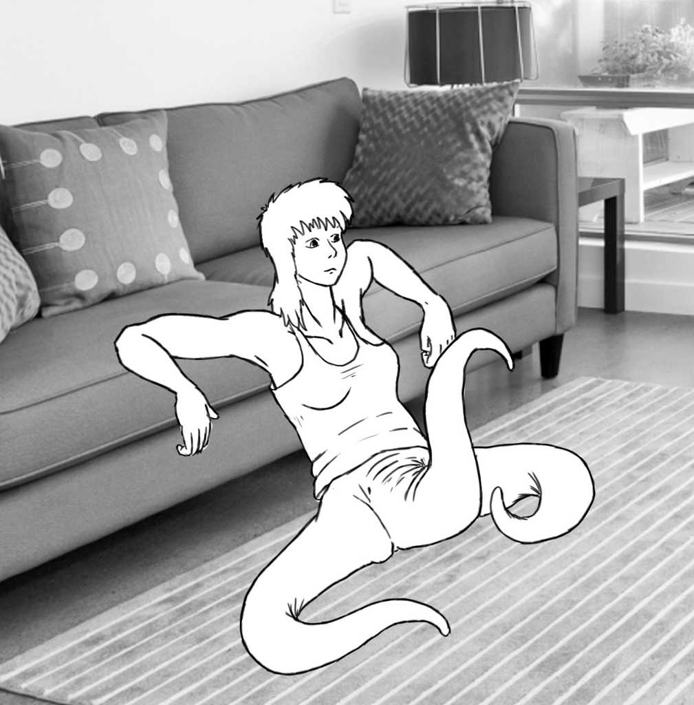 Seated on the floor contemplatively, leaning against the couch